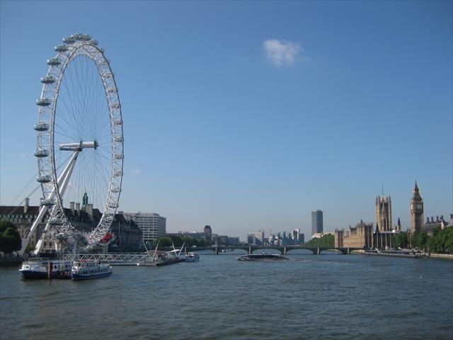 The Eye and House of Parliment from a bridge over the river Thames.